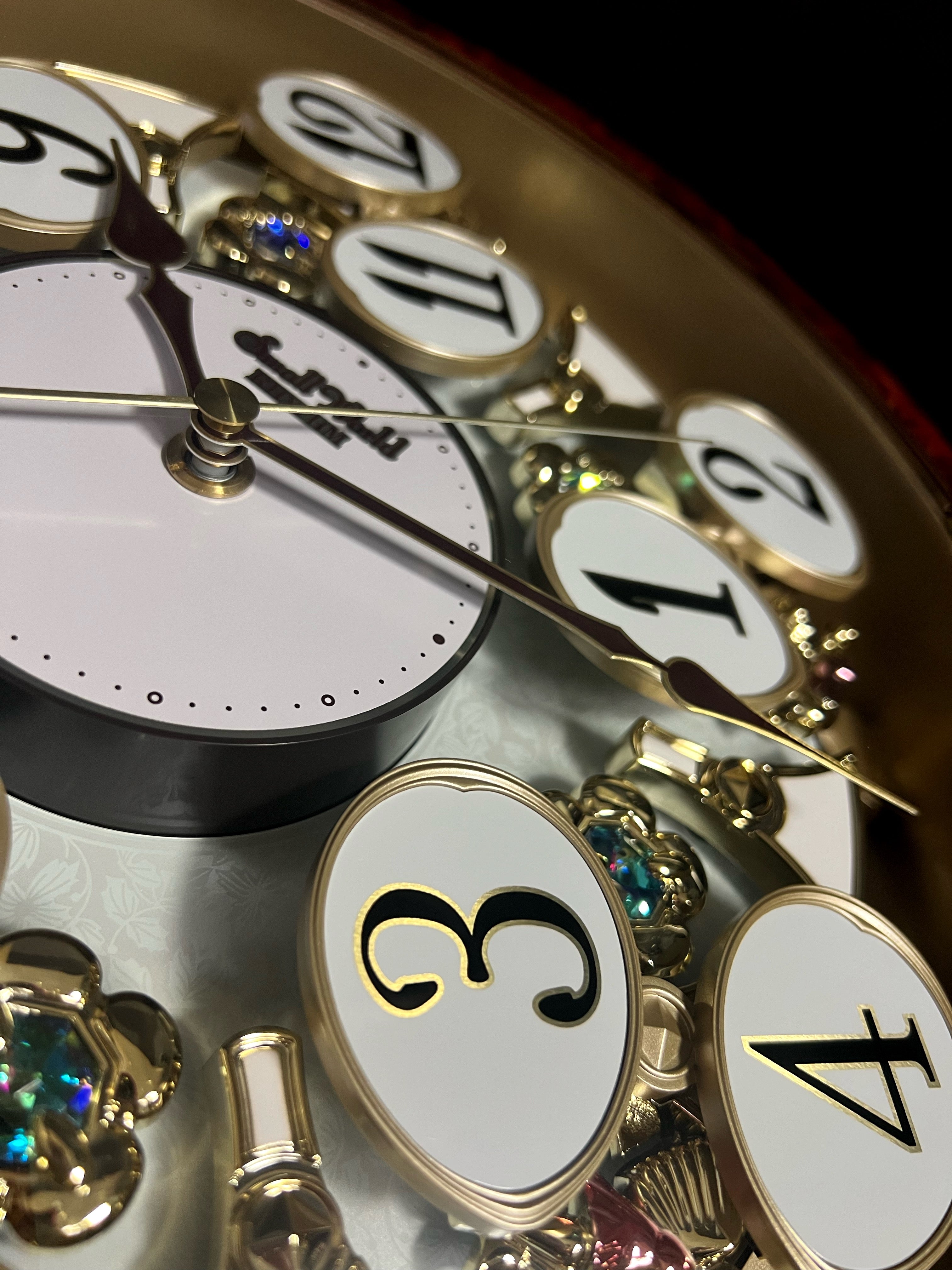 Rhythm “Woodgrain Blossom” Magic Motion Musical Wall Clock with