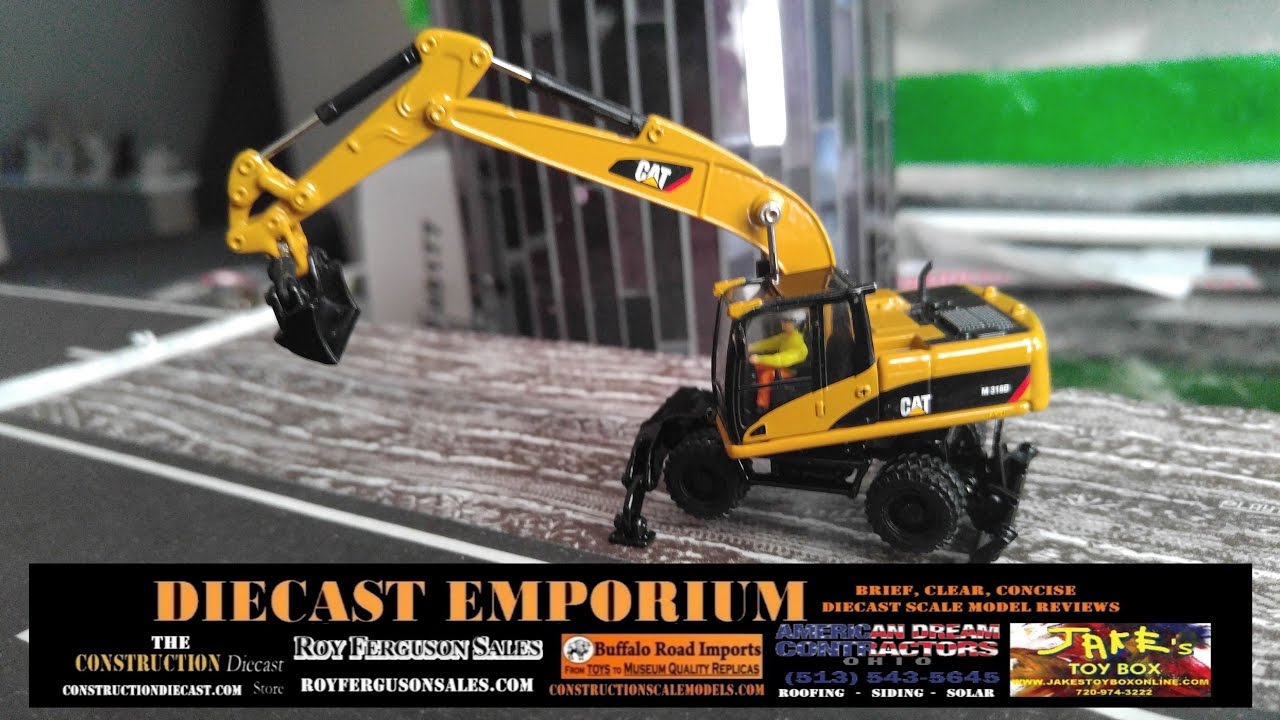 Diecast Masters Cat M318D Wheel Excavator (HO Scale) - YouTube