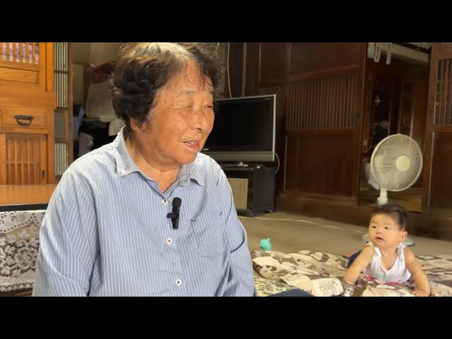 An 83-year-old grandmother plays with her 5-month-old great