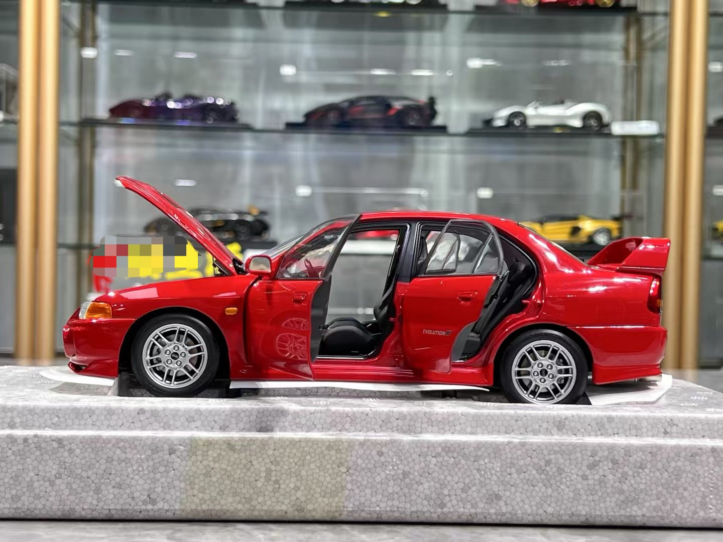 MotorHelix Lancer Evo IV 1/18 – IronCookie Diecasts