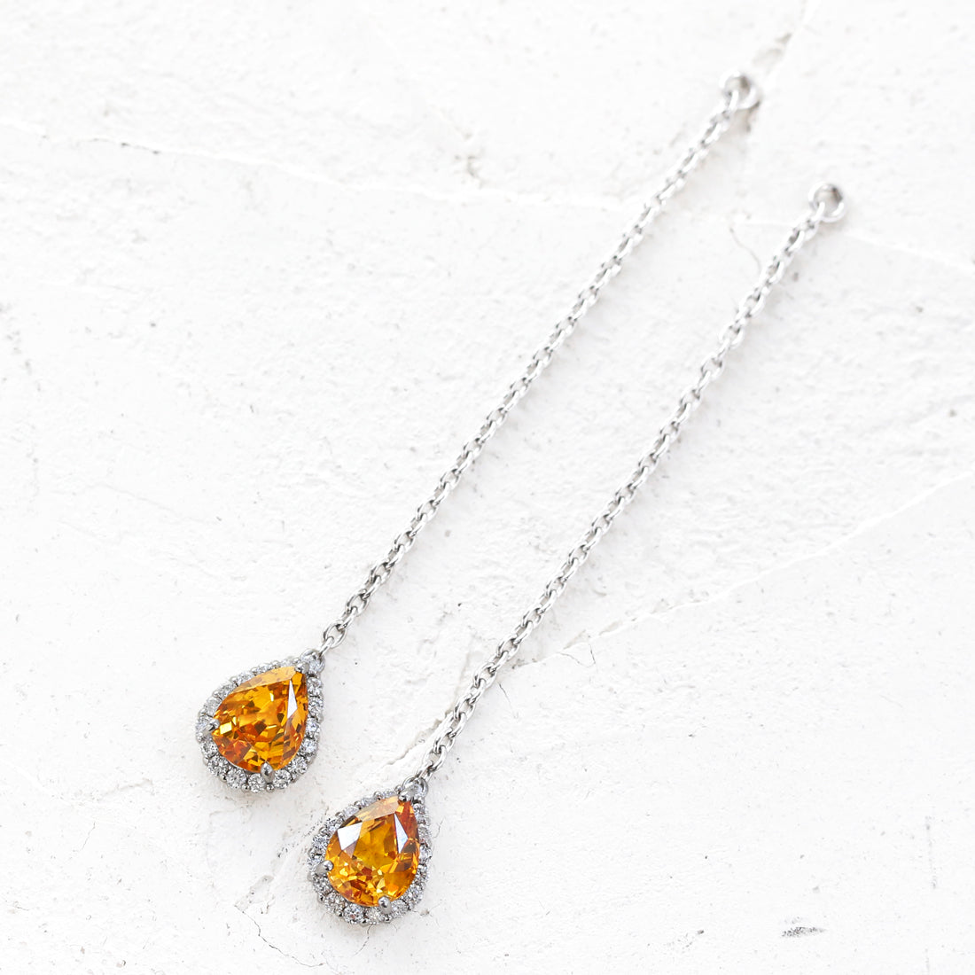 Etincelle -エタンセル- ペアシェイプ オレンジサファイアピアス